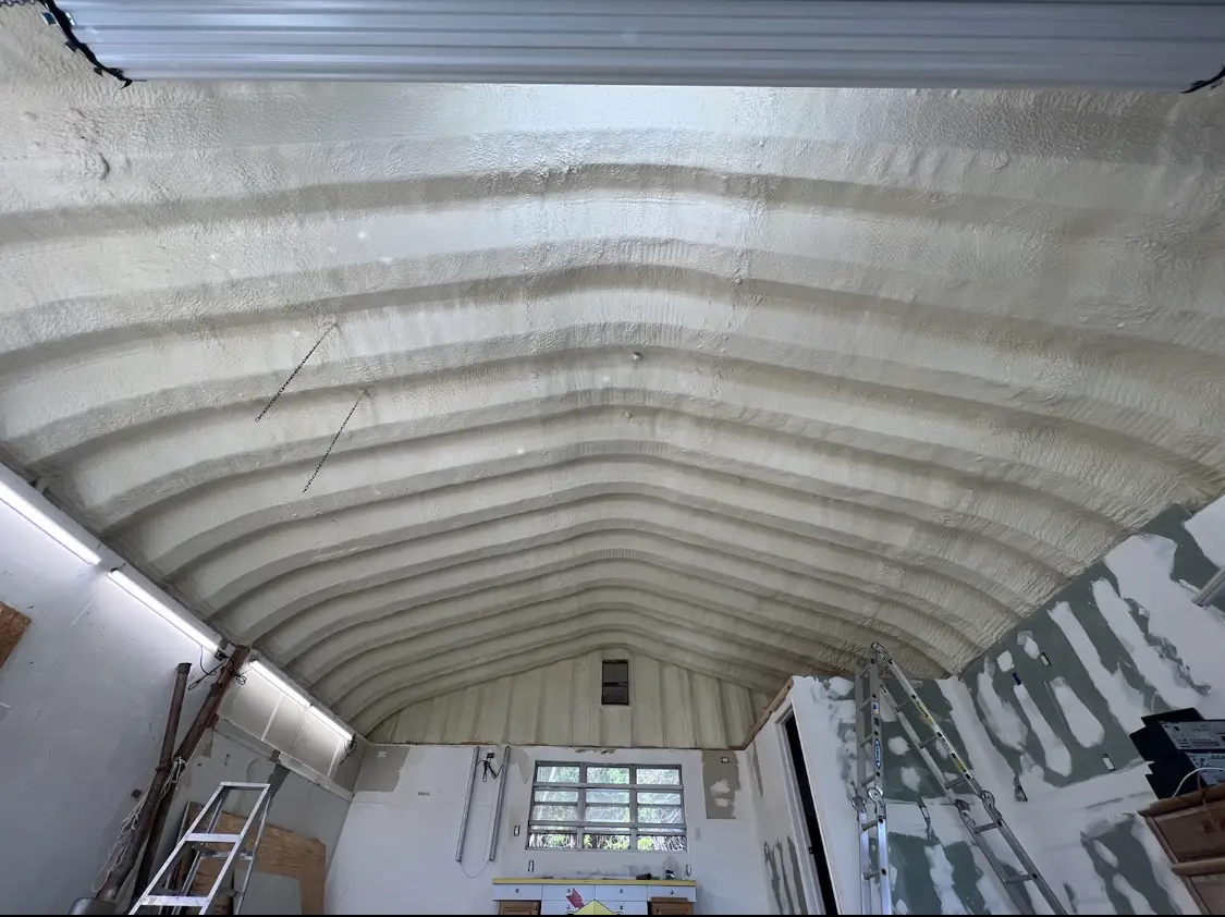 Spray polyurethane foam applied to the underside of a metal roof deck in Augusta